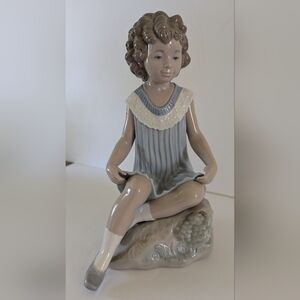 Lladro NAO Girl In A Blue Dress Sitting On A Rock